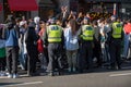 British police officers surround protesters at a Freedom for Palestine protest rally in London