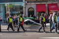 British police officers walk alongside protesters at a Freedom for Palestine protest rally in London