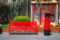 A British post and red bench