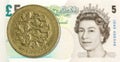 1 british pound coin against 5 pound sterling note obverse