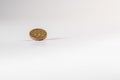 1 British pound coin falling on white background, isolated