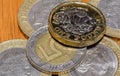 British Pound Coin on top of 5 Polish Zloty J Royalty Free Stock Photo