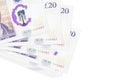 20 British pounds bills lies in small bunch or pack isolated on white. Mockup with copy space. Business and currency exchange