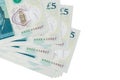 5 British pounds bills lies in small bunch or pack isolated on white. Mockup with copy space. Business and currency exchange