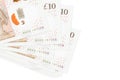 10 British pounds bills lies in small bunch or pack isolated on white. Mockup with copy space. Business and currency exchange