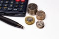 British pounds and pence coins and pen and calculator, business and currency Royalty Free Stock Photo