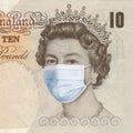 British Queen in a medical mask. Pandemic coronavirus concept. The collapse of the economy and the global financial crisis. UK Royalty Free Stock Photo