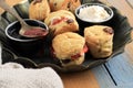 British Scones with Clotted Cream and Strawberry Jam for Afternoon Tea Time Royalty Free Stock Photo