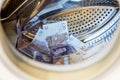 British Sterling Pounds Notes In Washing Machine. Money Laundering Concept Royalty Free Stock Photo