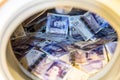 British Sterling Pounds Notes In Washing Machine. Money Laundering Concept Royalty Free Stock Photo