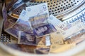 British Sterling Pounds Notes In Washing Machine. Money Laundering Concept Royalty Free Stock Photo