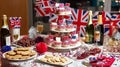 British-Themed Celebration Table with Cupcakes and Flags Royalty Free Stock Photo