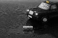 British traditional black cab taxi toy car with the word cab on beads Royalty Free Stock Photo