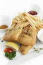 british traditional fish and chips meal in restaurant on white plate Royalty Free Stock Photo