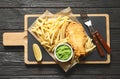 British Traditional Fish and potato chips on wooden background Royalty Free Stock Photo