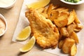 British traditional fish and potato chips on wooden background Royalty Free Stock Photo