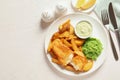 British Traditional Fish and potato chips on wooden background, flat lay. Royalty Free Stock Photo