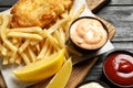 British traditional fish and potato chips on wooden table Royalty Free Stock Photo