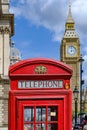 British traditional red telephone booth with the Big Ben in the background in London Royalty Free Stock Photo