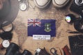 British Virgin Islands Flag Between Traveler`s Accessories on Old Vintage Map. Overhead Shot Royalty Free Stock Photo