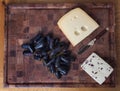British Wensleydale and Norwegian Jarlsberg cheese with long black grapes