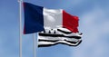 Brittany flag waving with french national flag on a clear day Royalty Free Stock Photo