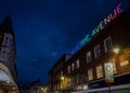 Brixton, London, UK: Electric Avenue in Brixton at night with neon sign