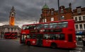 Brixton, London, UK: Buses on Brixton Road with Lambeth Town Hall opposite