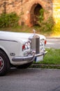 Detail of the front radiator and lights of a luxury old car