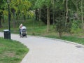 Mother pushing baby carriage