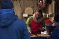 Woman sales grilled cheese at Christmas market
