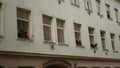 BRNO, CZECH REPUBLIC, FEBRUARY 29, 2020: People gypsies open window ghetto poor in Brno, Bratislavska street life people courtyard