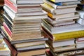 Brno, Czech Republic - June 22, 2019: Stacks of many old used books displayed at local antiquarian bookshop Royalty Free Stock Photo