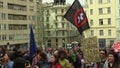 Brno, Czech Republic, May 1, 2019: People activists, flag against isosceles double cross in a circle, these are the main