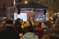 The stage and people are listening political speech on celebration of Velvet Revolution