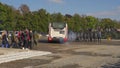 Brno, Czechia - October 08, 2021: Group of hooligans coming from sport match, about enter bus. Police commando standing near to