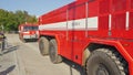 Brno, Czechia - October 08, 2021: Red heavy armoured fire fighting vehicles moving over stone road. Demonstration for public at