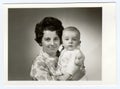 Retro photo shows mother and her son. Portrait photo was taken in photo studio on March, 1972
