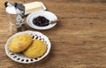 Broa, typical brazilian corn flour bread with butter, jam, coffee and copy space Royalty Free Stock Photo