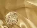 Broach beige silk Royalty Free Stock Photo