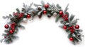 A broad arch-shaped Christmas border made up of fresh fir branches and ornaments in red and silver isolated on white Royalty Free Stock Photo