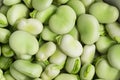 Broad beans close up, green, raw and fresh shelled fava beans and seed pods Royalty Free Stock Photo