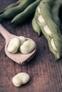 Broad Beans on a wooden Table with Spoon Royalty Free Stock Photo