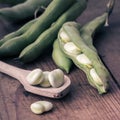 Broad Beans on a wooden Table with Spoon Royalty Free Stock Photo