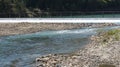 A broad dam spans across the river