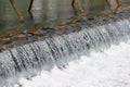 A broad dam spans across the river Royalty Free Stock Photo