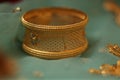 intricately designed gold bangle on display Royalty Free Stock Photo