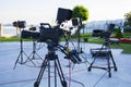 Broadcast tv; movie shooting or video production and film, tv crew team with camera Royalty Free Stock Photo