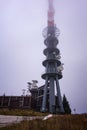 Broadcasting TV tower on hill Velka Javorina, in mist
