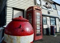 Old Lifeboat Station, red telephone box and WWII mine Royalty Free Stock Photo